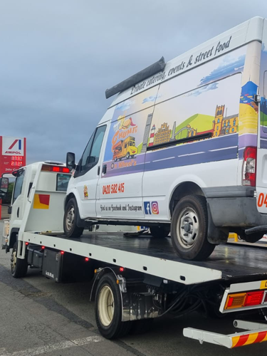 Big Boy's tow truck towing a van