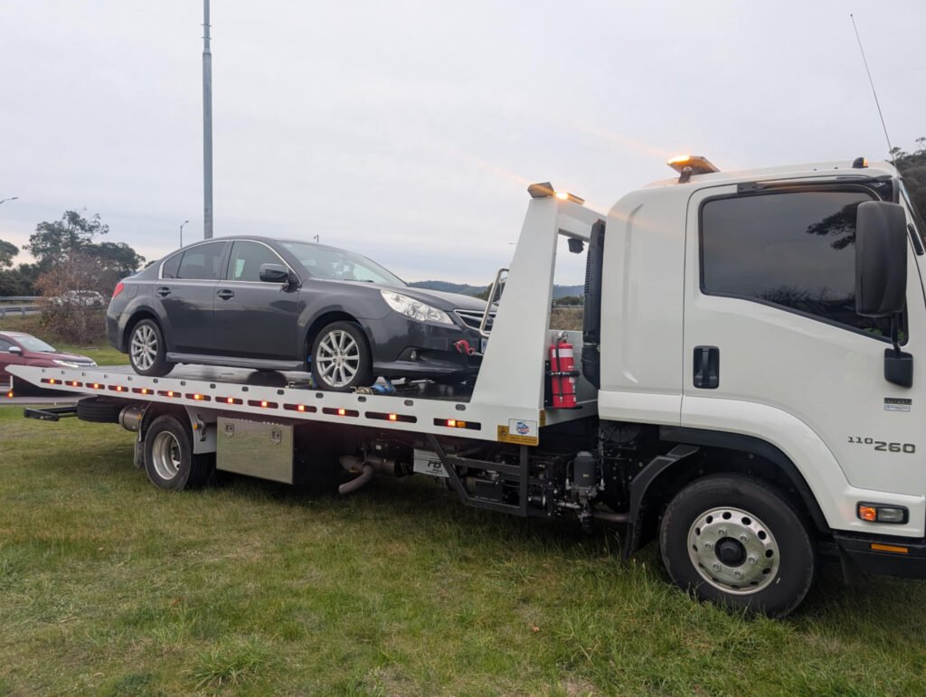 Big Boy Towing operating to tow a car in overcast condition