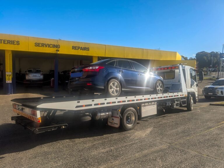 Professional 4x4 recovery truck winching a bogged vehicle near Hobart
