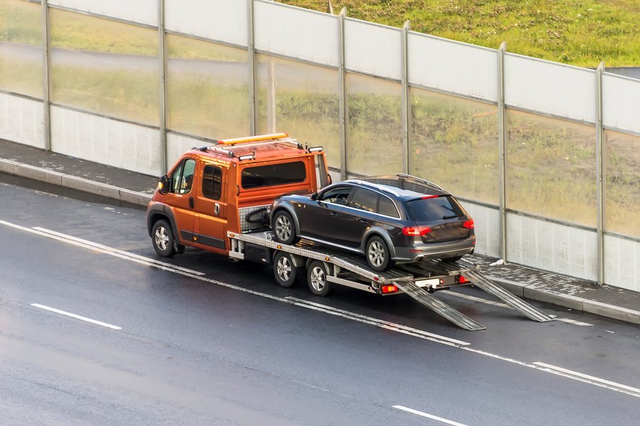 Towing an automatic car safely on a tilt tray truck in Hobart.