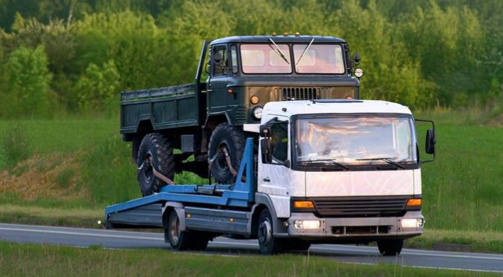 Car removal Glenorchy truck picking up a scrap vehicle near Northgate