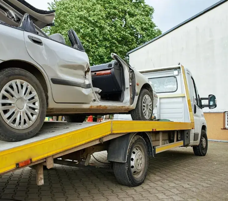 Car removal Tasmania service truck collecting a vehicle from a rural property.