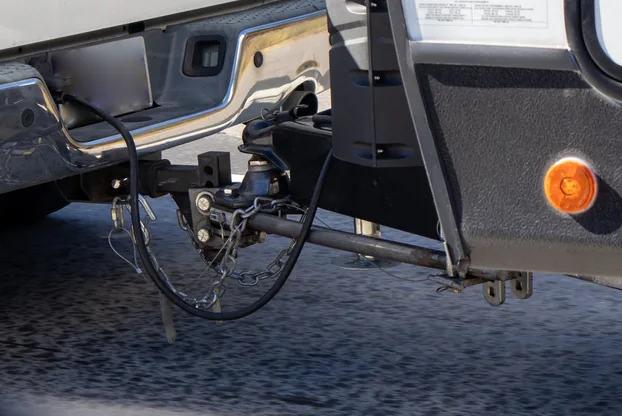 How to tow a trailer safely guide showing a secured load.